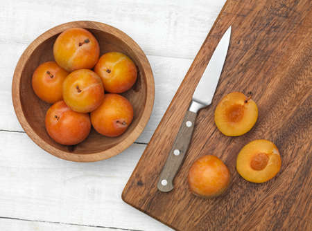 Plums ona kitchen work topの写真素材