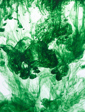 Ink with movement in waterの写真素材