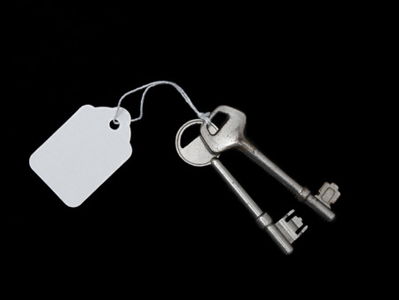 Keys Isolated on black with tagの写真素材