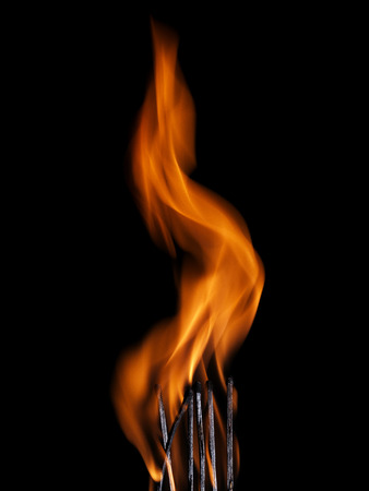 Macro shot of a flaming matchstickの写真素材