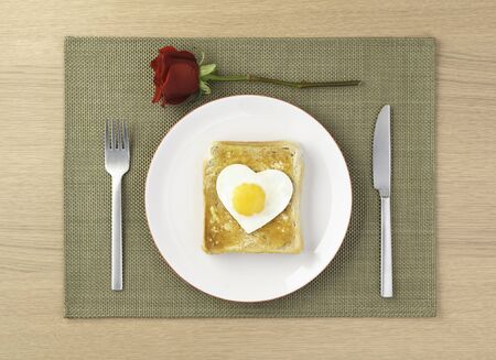 Egg on toast love dinnerの写真素材