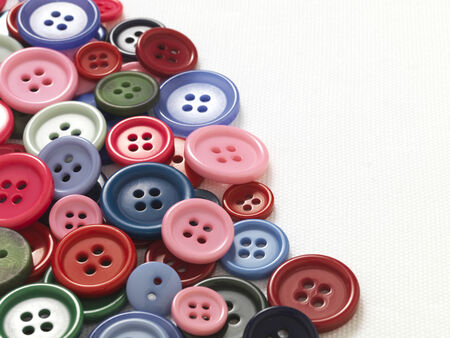 Buttons on white cotton backgroundの写真素材