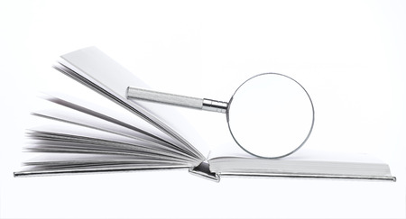 Magnifying Glass on open bookの写真素材