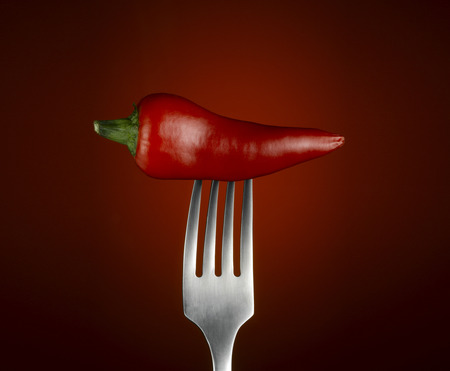 Chilli Pepper on forkの写真素材
