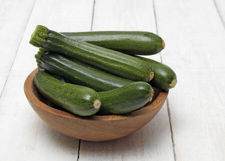 Fresh Courgettes on table topの写真素材