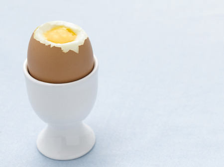 Cracked Boiled Egg on Blue tableclothの写真素材