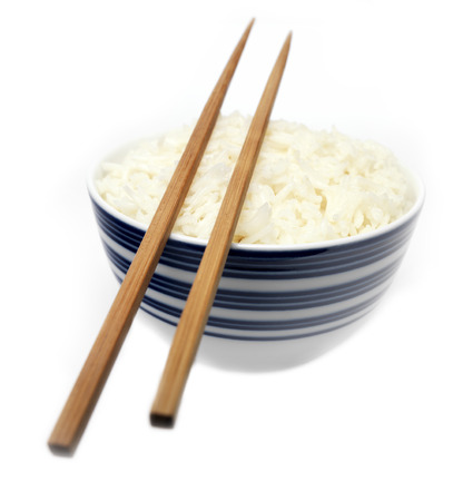Rice and Chopsticks with focus on the riceの写真素材