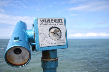 Coin operated telescope looking out to sea at british seaside close upの写真素材
