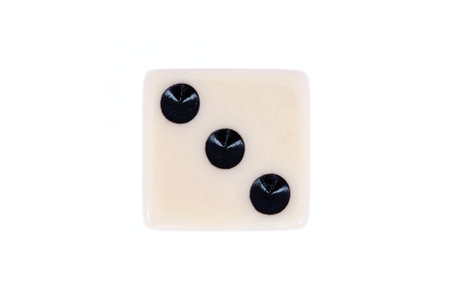 White dice with three black dots isolated on white. Top down view of Number 3 in a series of dice imagesの写真素材