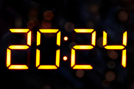 New Year 2024 digital clock display dark backgroundの写真素材
