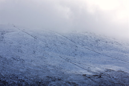 Glencoe mountain ski resort in snow and cloudの写真素材