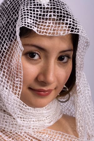 Attractive woman, head covered with white scarfの写真素材