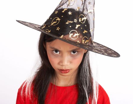 A young girl dressed in a witch costumeの写真素材