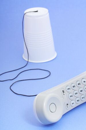 Photo of a telephone over a blue backgroundの写真素材
