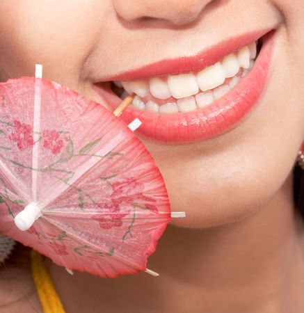 girl with a toothpick - pink parasolの写真素材