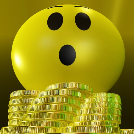 Surprised Smiley With Coins Showing Sudden Success And Profitsの写真素材