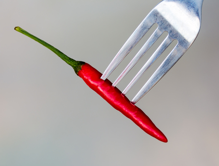 Chilli On Fork Meaning Red Pepper And Peppersの写真素材