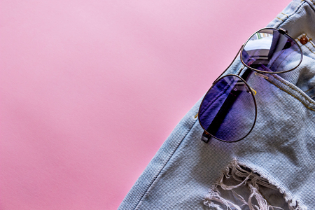 blue denim shorts with andsunglasses in pockets,の写真素材