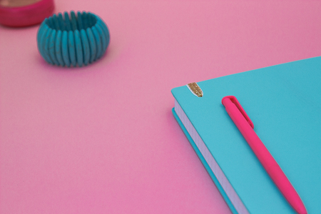 Mint notebook on pink color background and menthol braceletの写真素材
