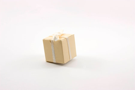 gift box tied with ribbon on white backgroundの写真素材