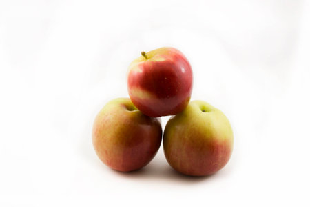 Three apples on a white backgroundの写真素材