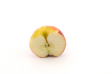 half apple sliced on a white backgroundの写真素材