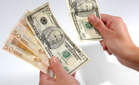 Hands in action, Dollars and Euros on a white background.  1-2 