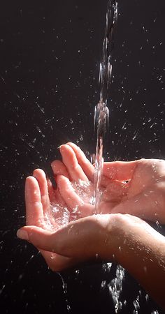 Hands and spring water
