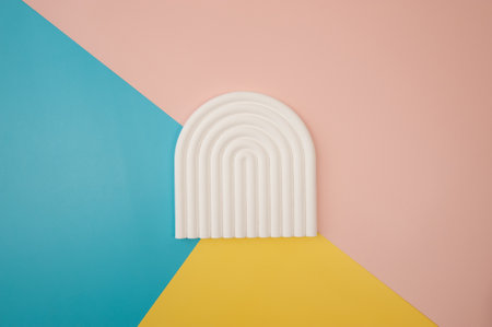 Blue, pink and yellow background. Colourful wallpaper, white abstract tray, product presentation.