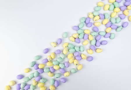 Top view of colourful easter eggs on white background. Creative easter composition, spring, copy...