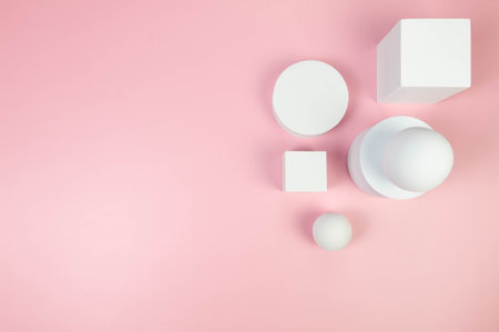 Top view of white round podiums, squares, white balls on pink background. Geometric abstract shapes for cosmetic product presentation. Flat lay, copy space.の写真素材