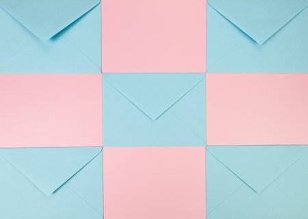 Top view of light blue envelopes on pink background. Post flat lay. Copy space.の写真素材