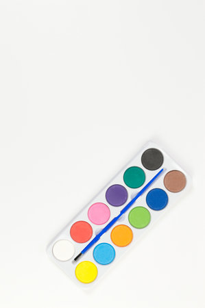Top view of watercolor and paint brush on white background. Painting, art, copy space, flat lay.の写真素材
