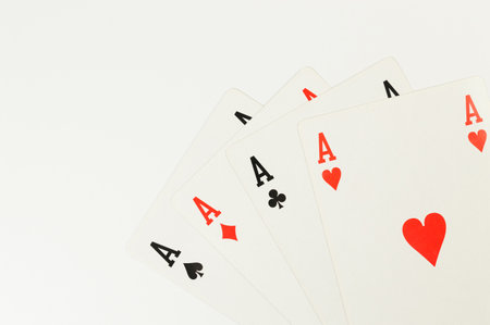 Top view of playing cards on white background. Four aces cards, board game, poker. Copy space, flat...