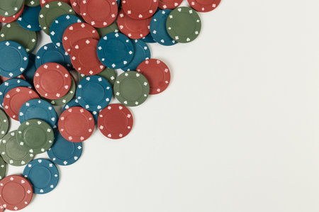 Top view of poker chips on white background. Lot of gambling chips. Board game, playing cards, poker, casino. Copy space, flat lay.の写真素材