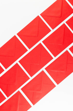 Top view of red envelopes on white background. Post flat lay. Copy space.の写真素材