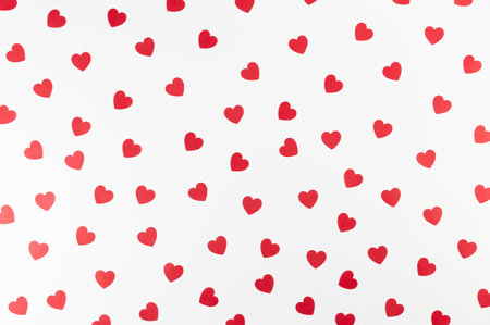 Top view of red hearts on white background. Valentine's day, red hearts, love wallpaper. Flat lay, copy space.の写真素材