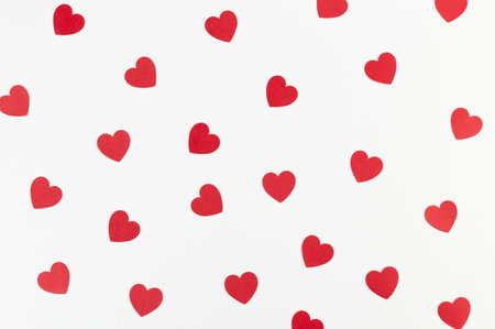 Top view of red hearts on white background. Valentine's day, red hearts, love wallpaper. Flat lay,...