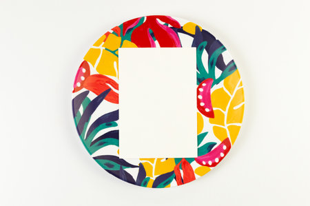 Top view of colorful plate, white card on white background. Exotic plant plate, summer picnic. Flat...