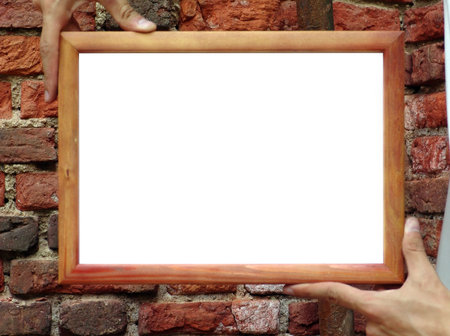Wooden frame in man hands / there is empty space for you text or   pictureの写真素材