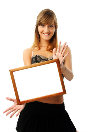 Happy young woman with empty frame.  More pictures of this girl in my portfolio. Please write me where you use my photos.の写真素材