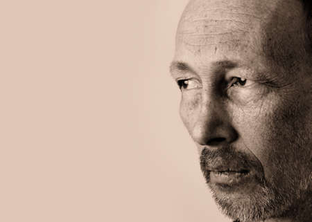 Sad man looking towards somebody and thinking about some problemsの写真素材