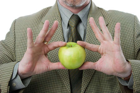 Fresh green apple in businessman handsの写真素材