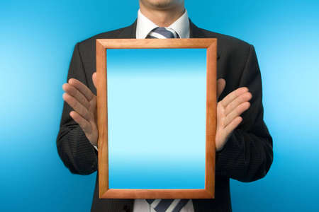 Businessman making a prosperous demonstration  of your product  or logo の写真素材