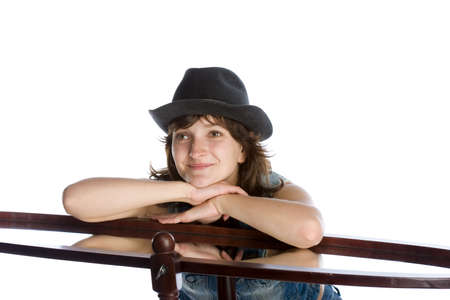 Woman in hat playing in front of the mirrorの写真素材