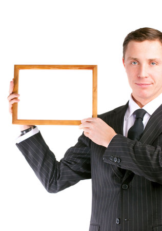 Businessman in stylish black suit holding empty frameの写真素材