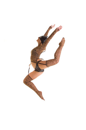 Young dancer in catsuit jumping. Isolated over white backgroundの写真素材