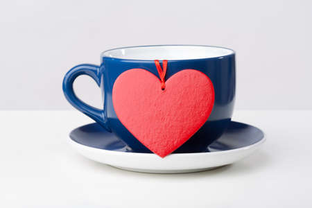 Blue cup with red heart over it