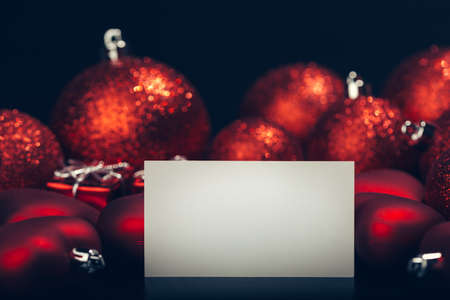 Empty card over dark red christmas backgroundの写真素材