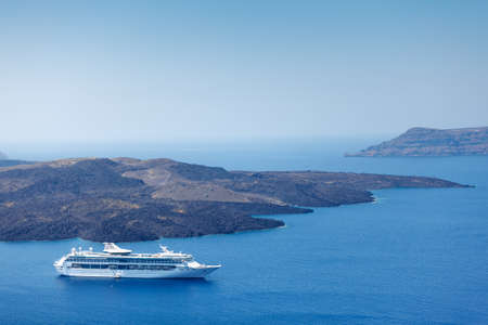 Big cruise ship in the caldera, Santorini island, Greece. View from the Oia village. Wide angleの写真素材